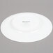 An Arcoroc white porcelain salad plate with a white rim.