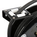 An Equip by T&S black metal hose reel with white plastic handles and a black and white cable.
