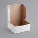 A white box with a lid open.