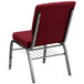 A burgundy Flash Furniture church chair with metal legs.