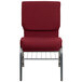A red chair with metal legs and a metal frame.