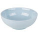 A light blue Thunder Group Blue Jade melamine soup bowl with a white rim.