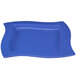 A blue rectangular platter with a curved edge.