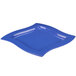 A blue square Tablecraft cast aluminum platter with a curved edge.