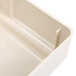 A beige plastic drawer with a handle.