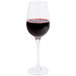A Thunder Group plastic wine glass filled with red wine.