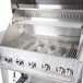 A stainless steel Crown Verity grill top with four burners.