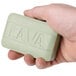 A person holding a Lava bar of soap.