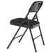A National Public Seating black metal folding chair with a black fabric cushion.