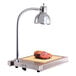 An Alto-Shaam heated carving station with a meat on a table.