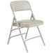 A National Public Seating gray metal folding chair with a warm gray vinyl padded seat.
