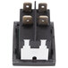 A close-up of a black and white Avantco rocker switch.