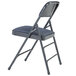 A National Public Seating metal folding chair with an Imperial Blue cushion.