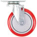 A red and white Winholt swivel plate caster with a metal wheel.