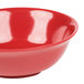 A red bowl with a speckled surface.