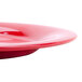 A close-up of a red GET Sensation wide rim plate.