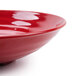 A close up of a red GET Red Sensation melamine bowl.