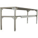 A Delfield stainless steel double overshelf on a metal table.
