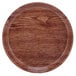 A round wooden plate with a white rim.
