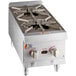 A stainless steel Cooking Performance Group countertop gas range with two burners and knobs.