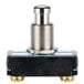 A close-up of a black and metal Nemco push button switch.