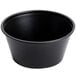 A Solo black polystyrene souffle cup on a white background.