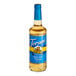 A Torani Sugar-Free English Toffee flavoring syrup 750 mL glass bottle with a blue label.