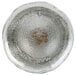 A clear glass bowl with a yellow mark inside.
