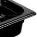A black Rubbermaid plastic food pan with a lid on it.