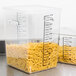 Two Rubbermaid food storage containers filled with pasta on a counter.