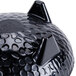 A black melamine bowl with a pointy design resembling a cat's face with holes in the design.