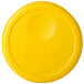 A yellow plastic lid with a circle in the middle.