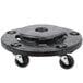 A black plastic Rubbermaid dolly with wheels and a center hole.