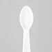 A Solo white plastic taster spoon.
