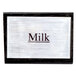 An American Metalcraft wood "Milk" sign on a counter.