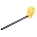 A Carlisle Flo-Pac toilet bowl brush with yellow bristles and a black handle.
