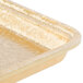 A MFG Tray Goldtex fiberglass bakery display tray with gold trim on it.