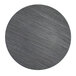 A round gray pine faux wood plastic charger plate on a wood surface.