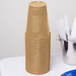 Creative Converting 28103081 16 oz. Glittering Gold Solid Plastic Cup - 240/Case Main Thumbnail 3