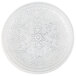 A white glass charger plate with a pattern on it.