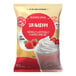 A white bag of Big Train Strawberry Blended Creme Frappe Mix with a label.