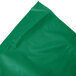 A package of Creative Converting emerald green plastic table skirts.