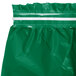 An emerald green plastic table skirt with white tape along the top edge.