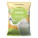 A bag of Big Train Dragonfly Honeydew Blended Creme Frappe Mix with text and images of a drink.