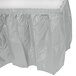 A white plastic table skirt on a table.
