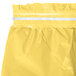 A Creative Converting yellow plastic table skirt with a white strip.