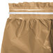 A close-up of a wrinkled tan plastic table skirt with a white strip.