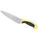 A Mercer Culinary Millennia Colors chef knife with a yellow handle and black blade.