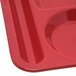 A red Carlisle melamine tray with 6 compartments.
