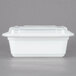 A white Pactiv rectangular plastic container with a lid.
